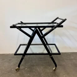 Pamono Black-Stained Beech Wood Trolley with Metal Wheels and Glass Shelves, 1950s Clearance