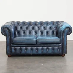 Pamono Fantastic 2-Seater Leather Chesterfield Sofa with a Denim Blue Colour.