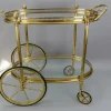 Pamono Mid-Century Modern 2-Tier Brass and Glass Bar Cart in the style of Maison Baguès, 1950s Online
