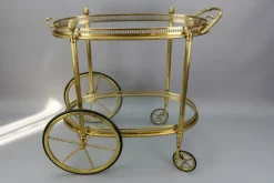 Pamono Mid-Century Modern 2-Tier Brass and Glass Bar Cart in the style of Maison Baguès, 1950s Online