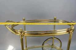 Pamono Mid-Century Modern 2-Tier Brass and Glass Bar Cart in the style of Maison Baguès, 1950s Online