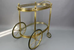 Pamono Mid-Century Modern 2-Tier Brass and Glass Bar Cart in the style of Maison Baguès, 1950s Online