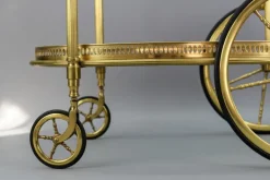 Pamono Mid-Century Modern 2-Tier Brass and Glass Bar Cart in the style of Maison Baguès, 1950s Online