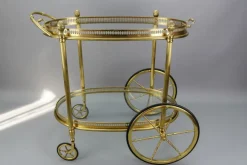 Pamono Mid-Century Modern 2-Tier Brass and Glass Bar Cart in the style of Maison Baguès, 1950s Online
